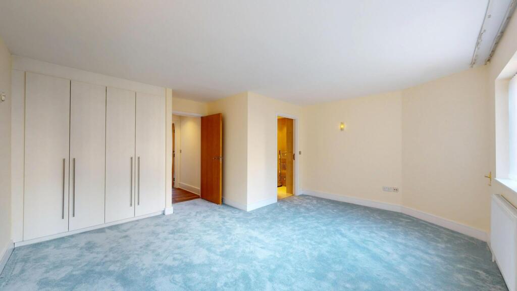 Bright and spacious living room featuring a lar...