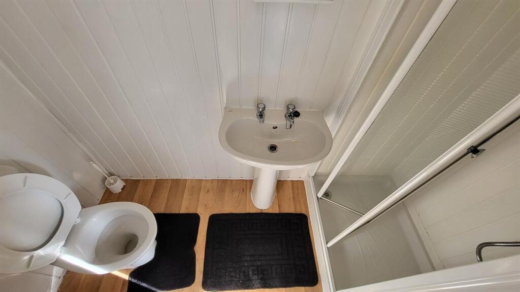 A clean and well-maintained single toilet featu...