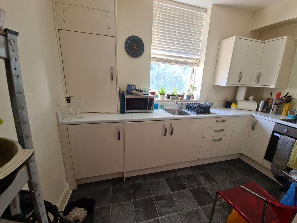 A well-lit kitchen with ample counter space, fe...