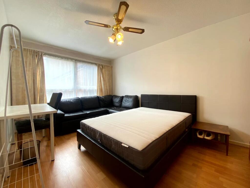 Spacious master bedroom featuring ample natural...
