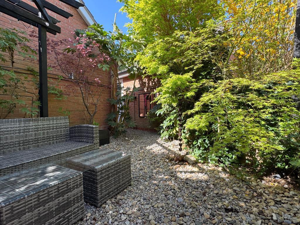 Rear garden leading to garage