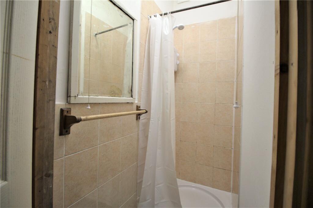 A clean and functional bathroom featuring a til...