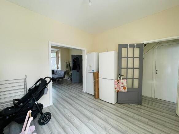 A bright and clean kitchen space featuring ligh...