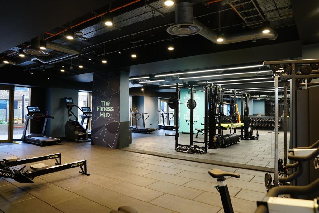 A modern and well-equipped fitness hub featurin...