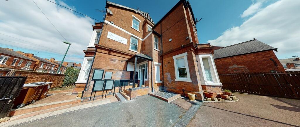 A charming exterior view of the property featur...