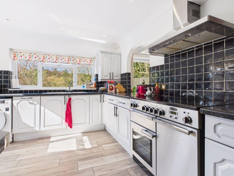 Kitchen with open hatch to dining area 