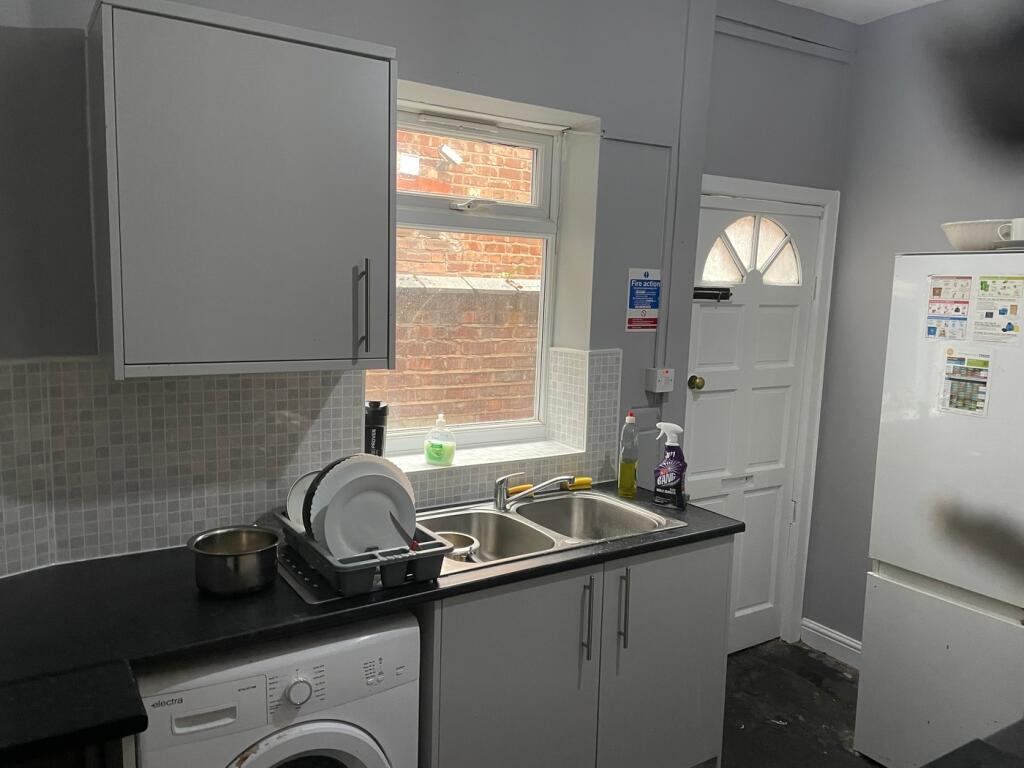 A functional kitchenette with good lighting, fe...