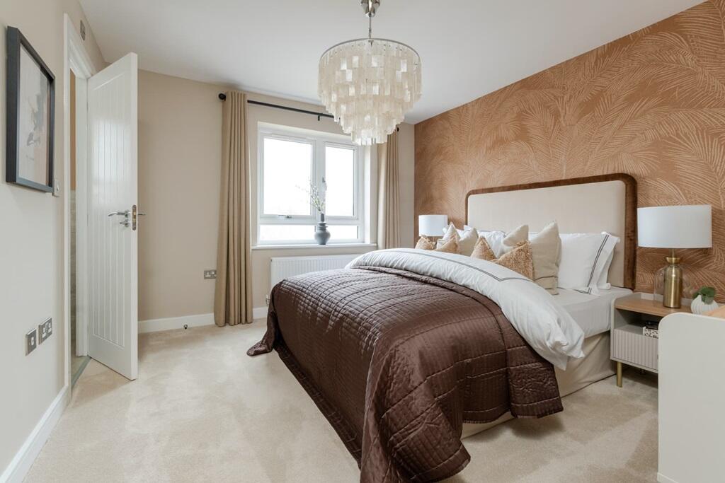 A generously sized bedroom 1