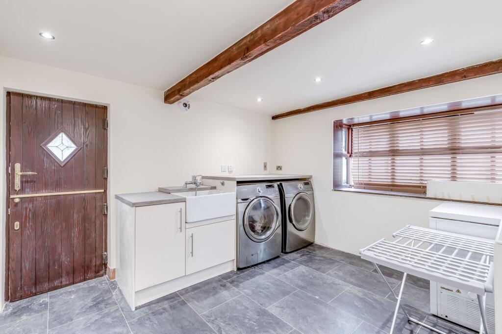 Laundry room / potential 6th bedroom