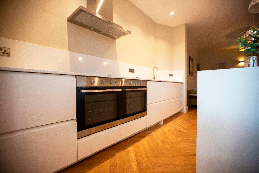 A modern and tidy kitchen with sleek design and...