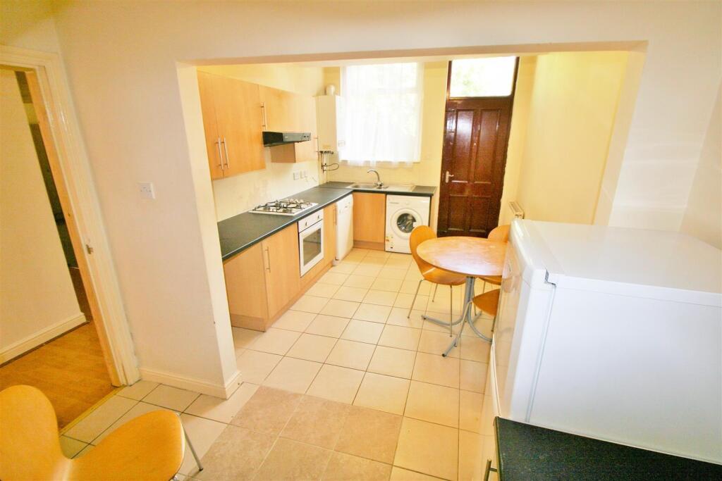 Bright and functional kitchen with modern woode...