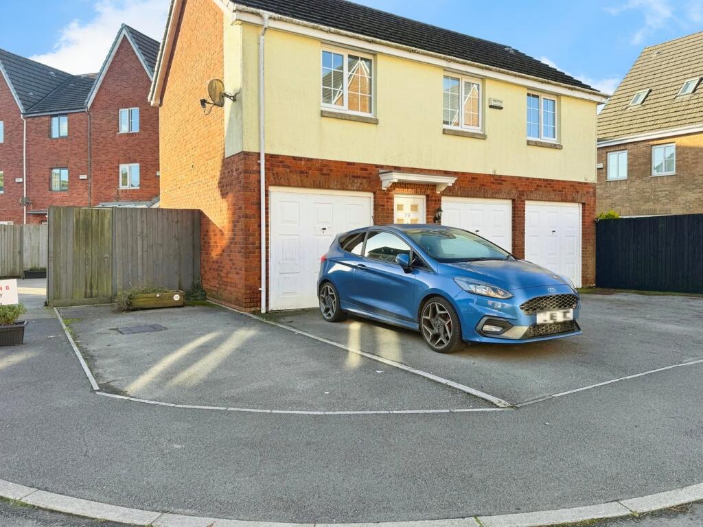 Two Parking Spaces and Garage