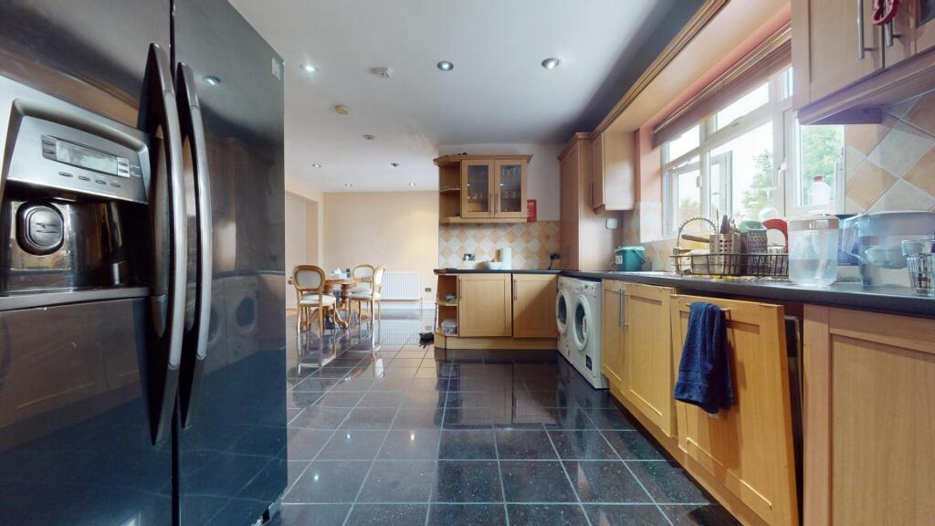 A bright and spacious kitchen featuring modern ...