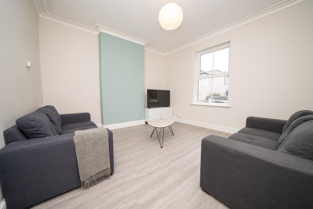 A modern living room featuring two comfortable ...