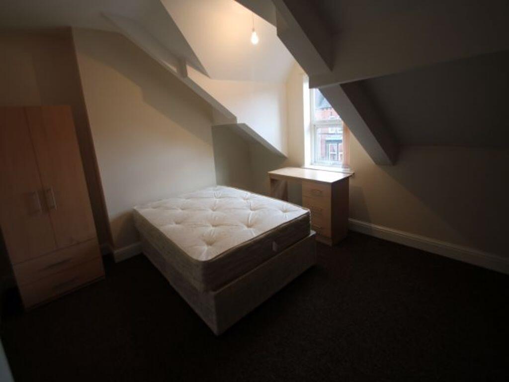 Bright attic-style double bedroom with a double...