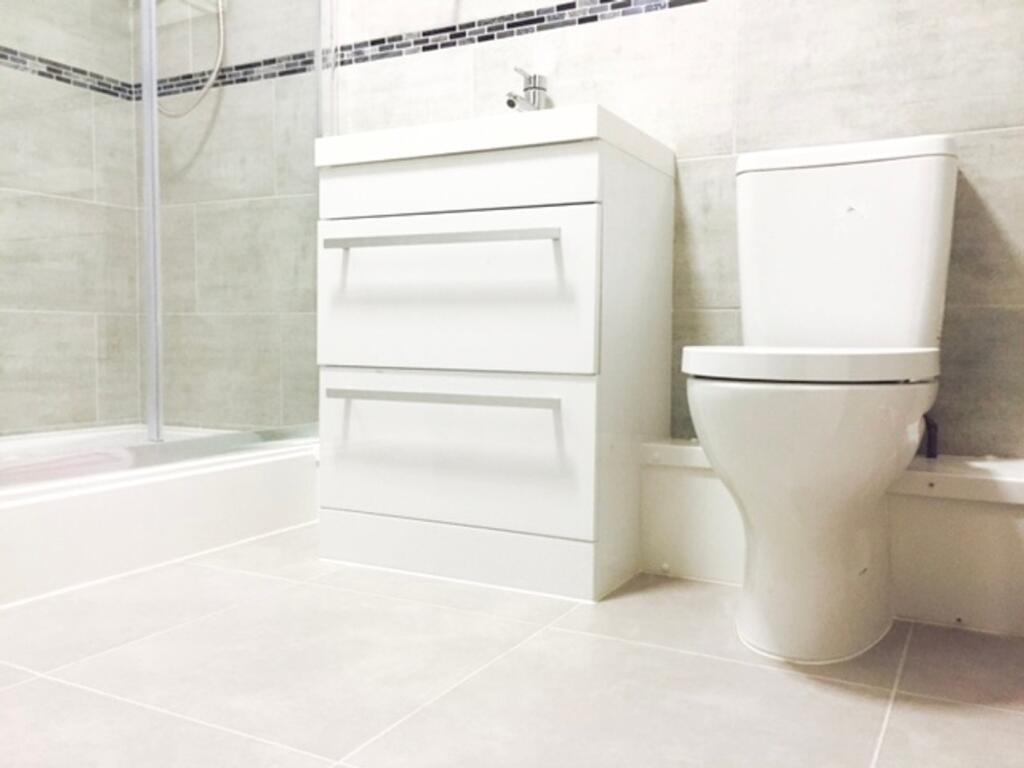 A modern bathroom featuring sleek, clean lines ...