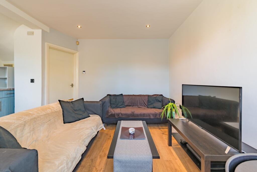A comfortable living room featuring two sofas w...