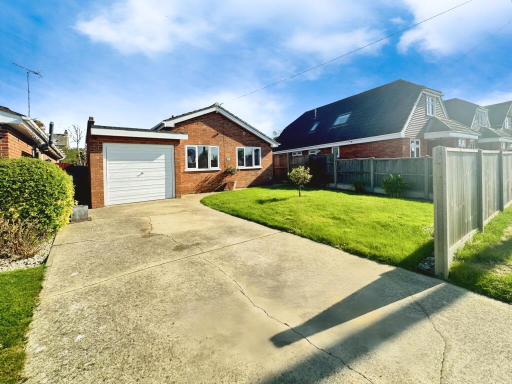 Front View Of The Property With Driveway Parking