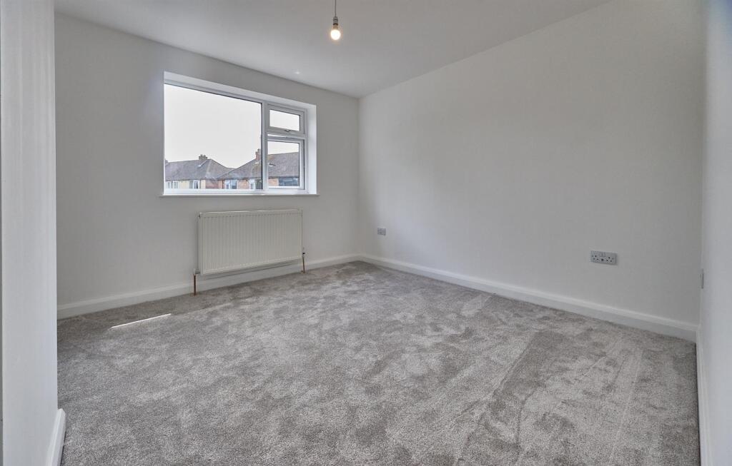 BEDROOM ONE TO REAR