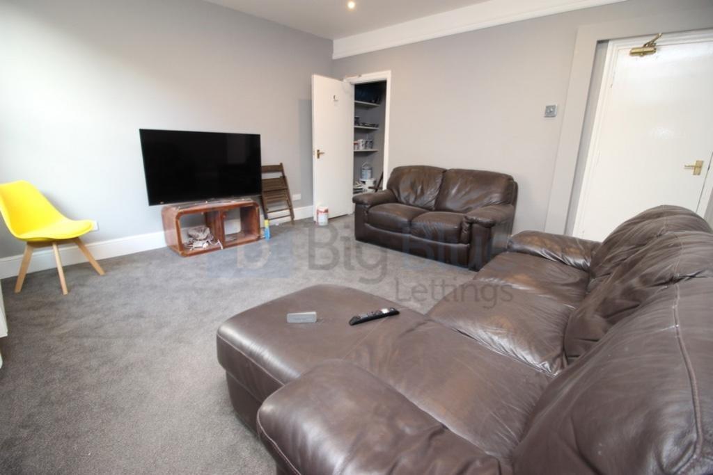 A cozy living room featuring comfortable leathe...