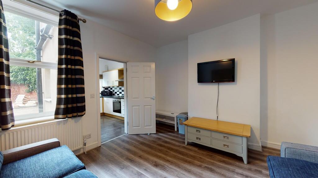 Bright and inviting living room with large wind...