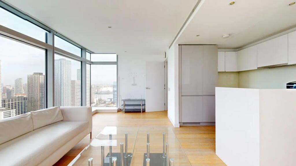 A bright and modern living room with floor-to-c...