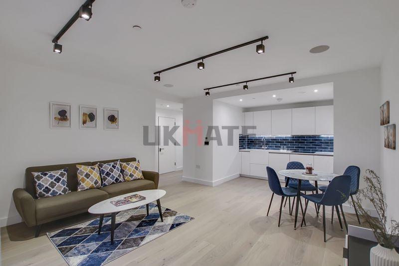 Bright and modern living area with ample natura...