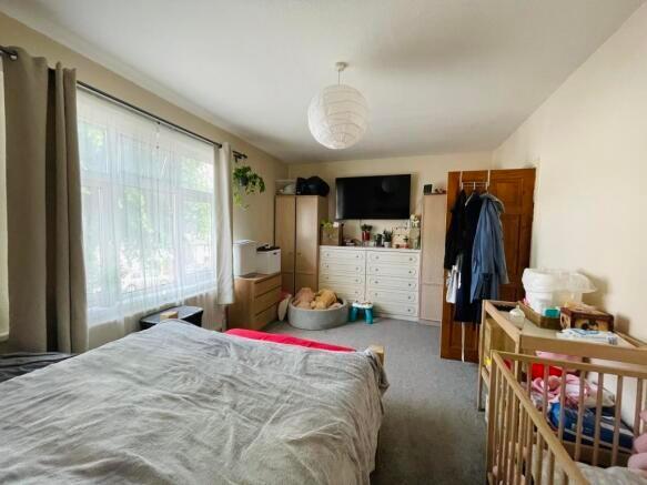 Bright and inviting master bedroom featuring a ...