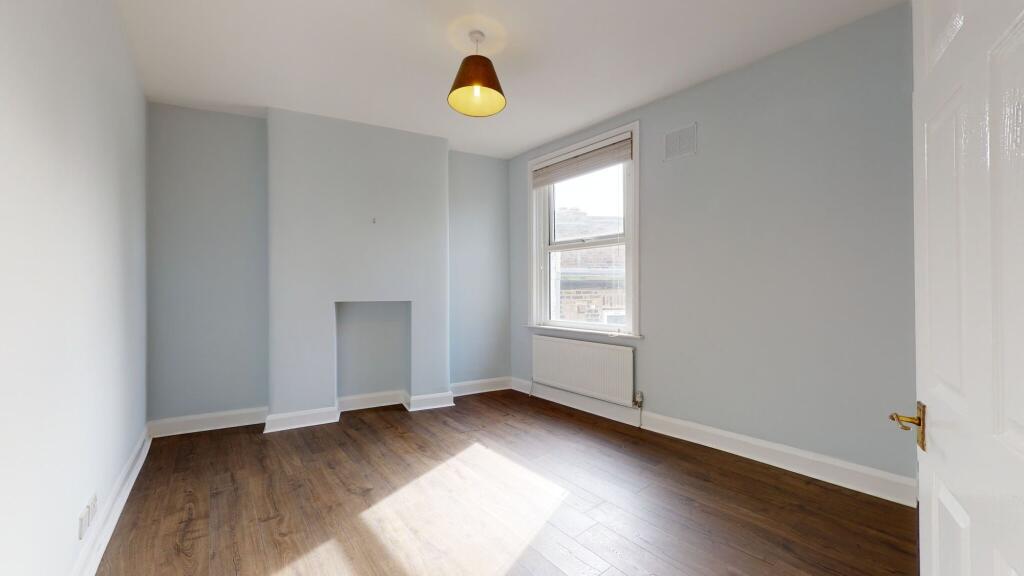 Bright and spacious master bedroom featuring so...