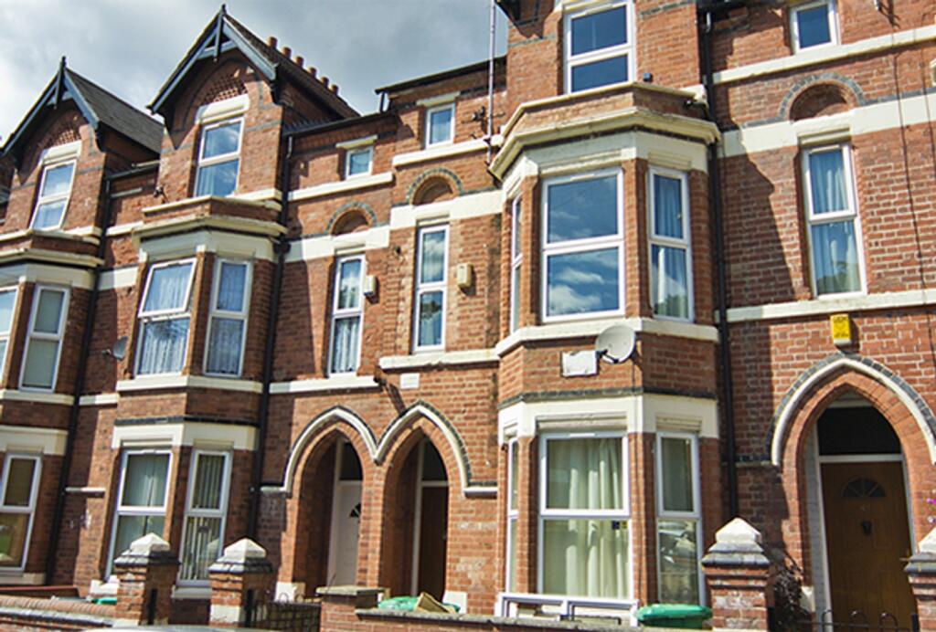 An inviting exterior view of a charming brick p...