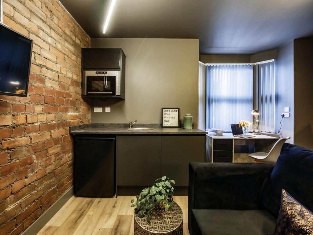 A contemporary living space featuring a stylish...