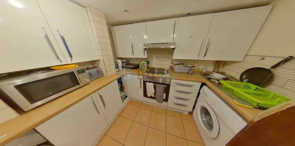 A compact and well-organized kitchen featuring ...