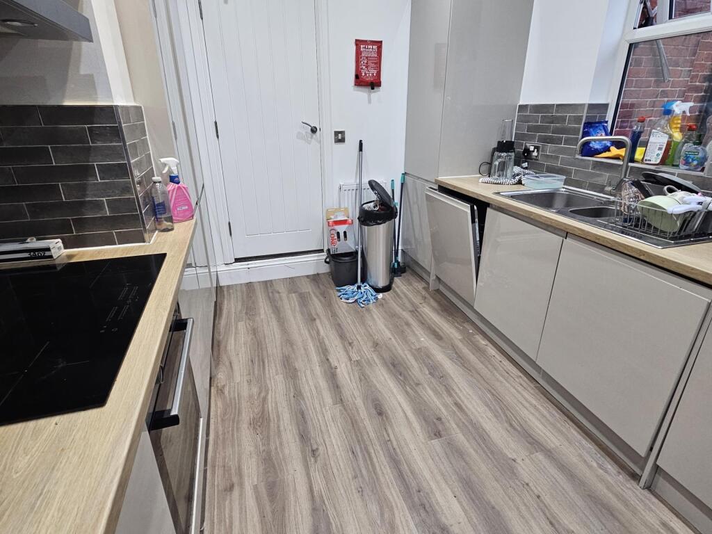 Modern and clean kitchen area with ample counte...