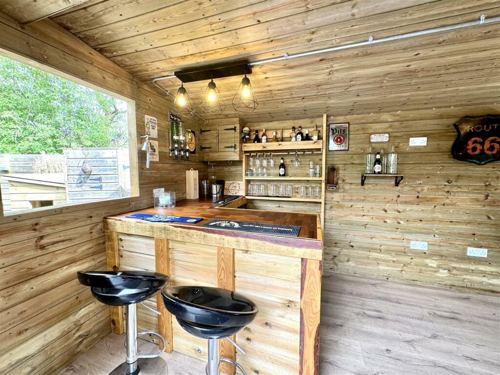 OUTSIDE HOME OFFICE/BAR/HOBBY ROOM