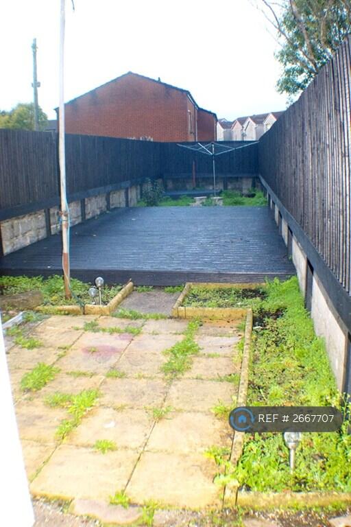 Garden With Patio, Decking And Rotary Line