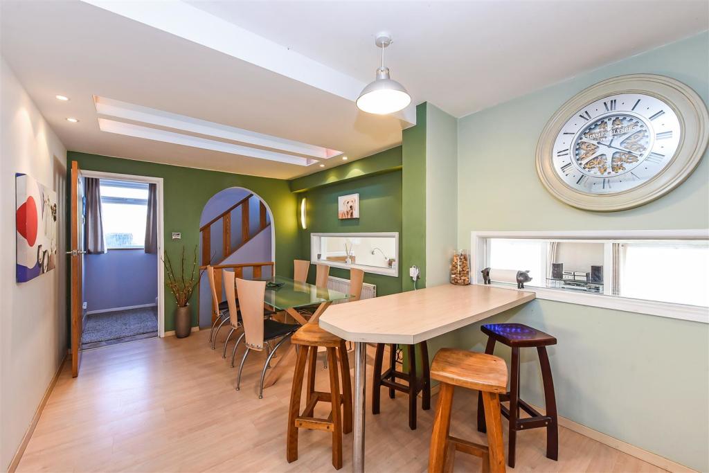 Dining Area and Breakfast Bar With Views Through T