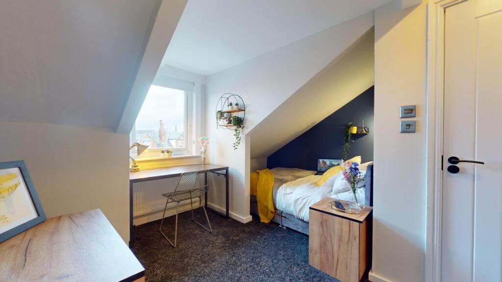 This charming double bedroom features a cozy la...