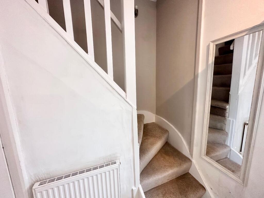 TO THE FIRST FLOOR LANDING