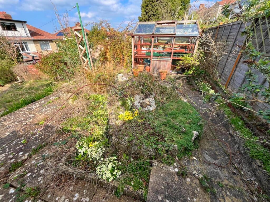 Top patio pond and greenhouse.jpg
