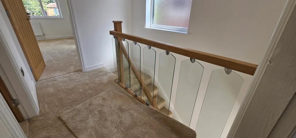 A stylishly designed staircase featuring elegan...