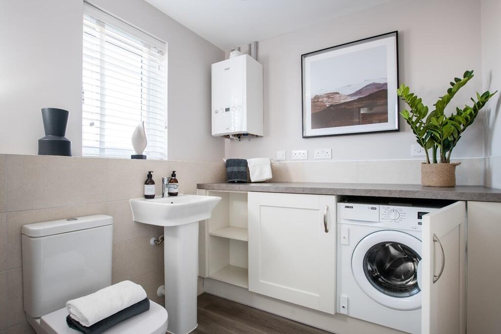 A downstairs toilet and utility room adds convenience