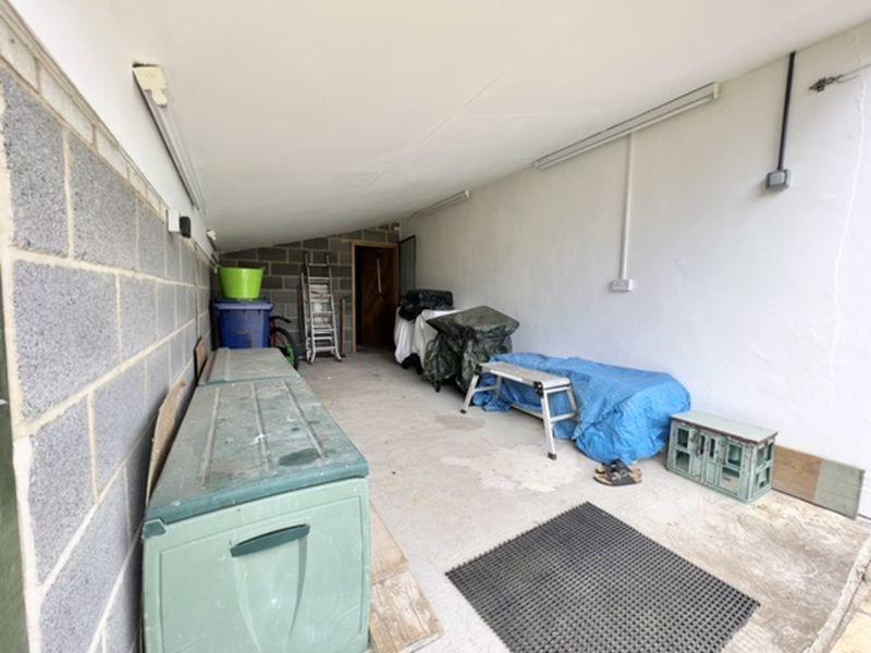 Covered open fronted work/storage space