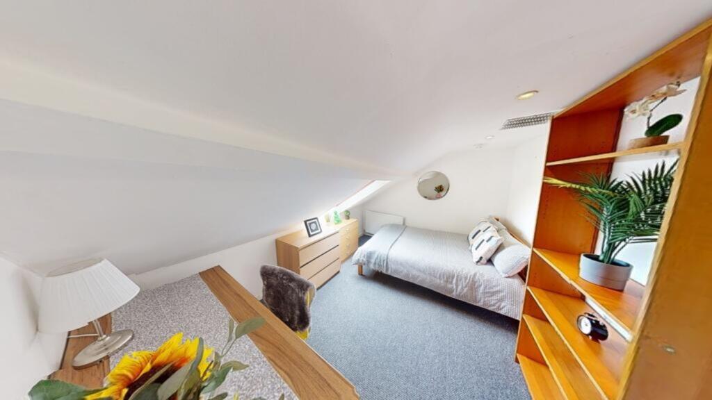 A bright and inviting double bedroom featuring ...