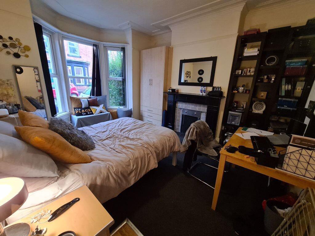 A cozy and inviting master bedroom featuring a ...