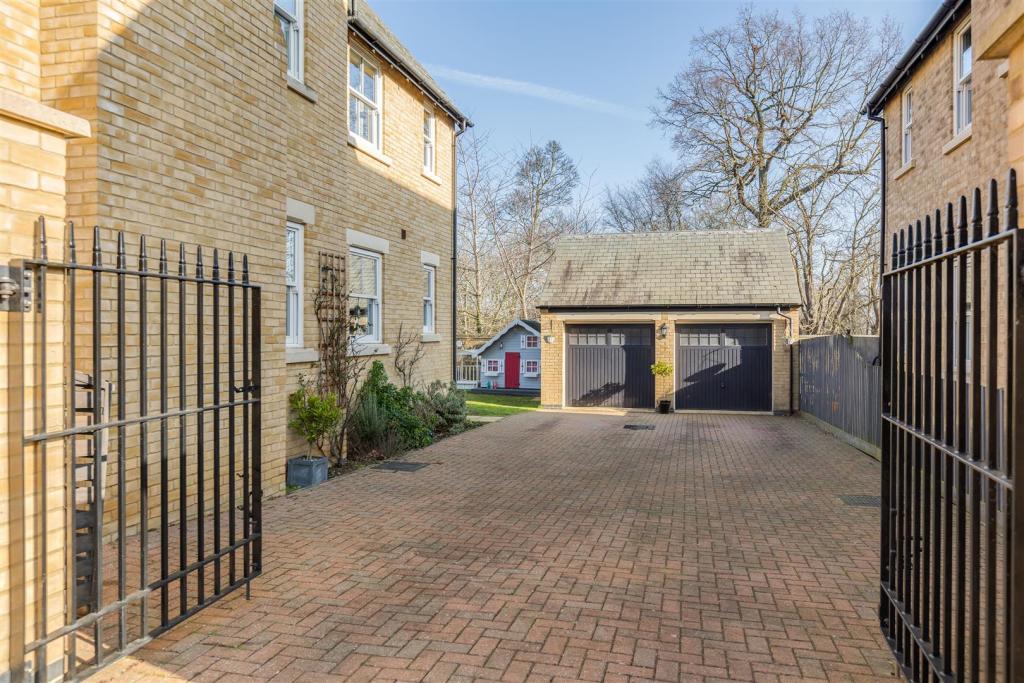 Gated Driveway to Double Garage