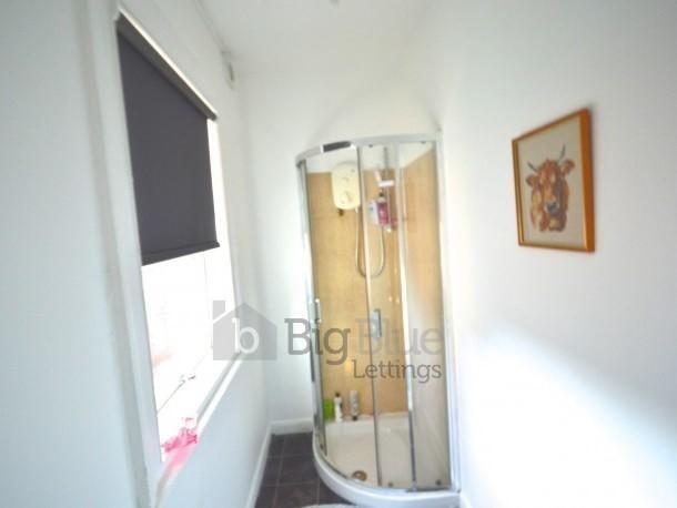Bright and modern bathroom featuring a spacious...