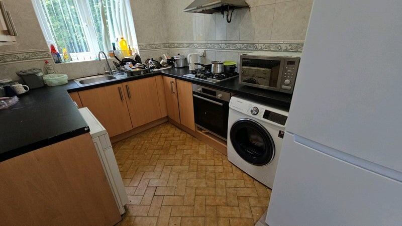 Bright galley-style kitchen with good counter s...