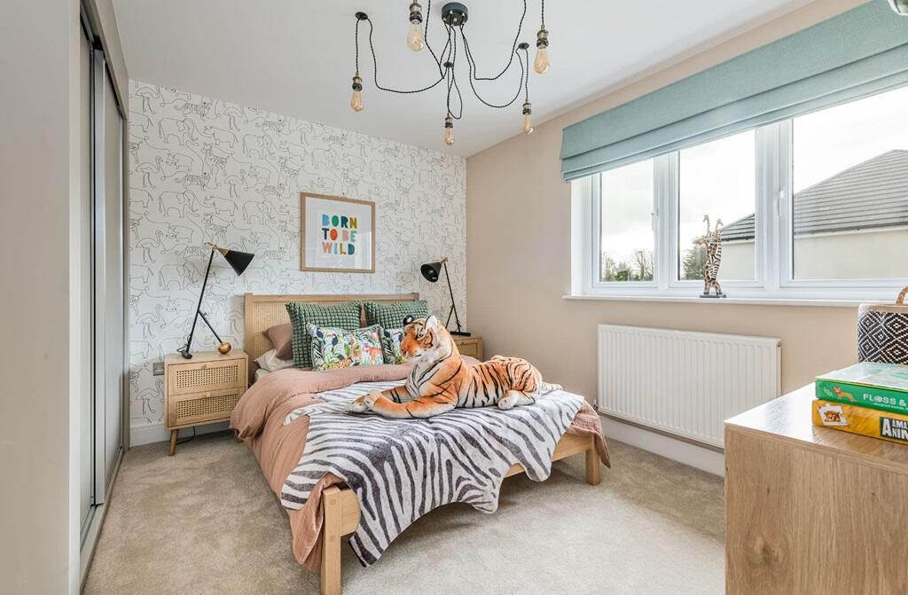 Bedroom 3 enjoys views over the rear garden