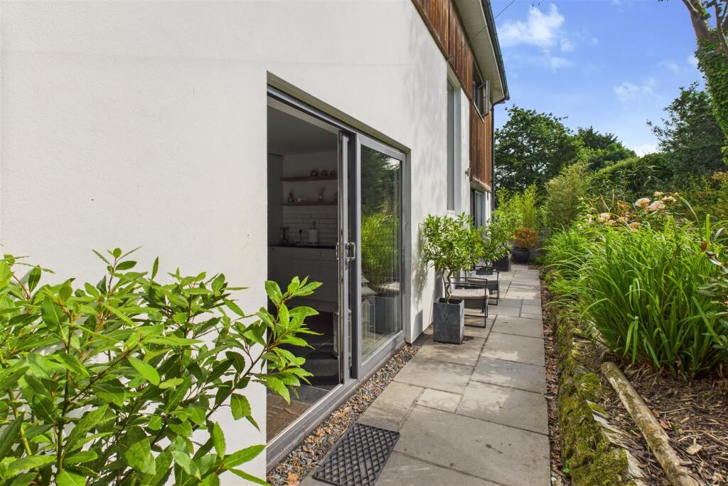 Rear accessed from Kitchen and Snug