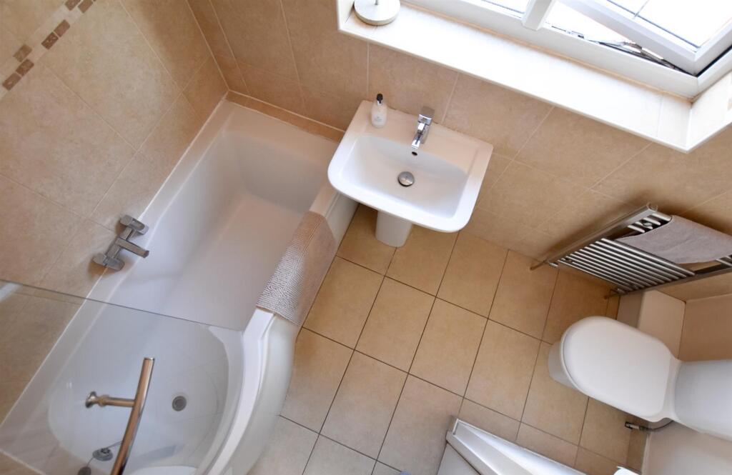 FAMILY BATHROOM WITH SHOWER OVER